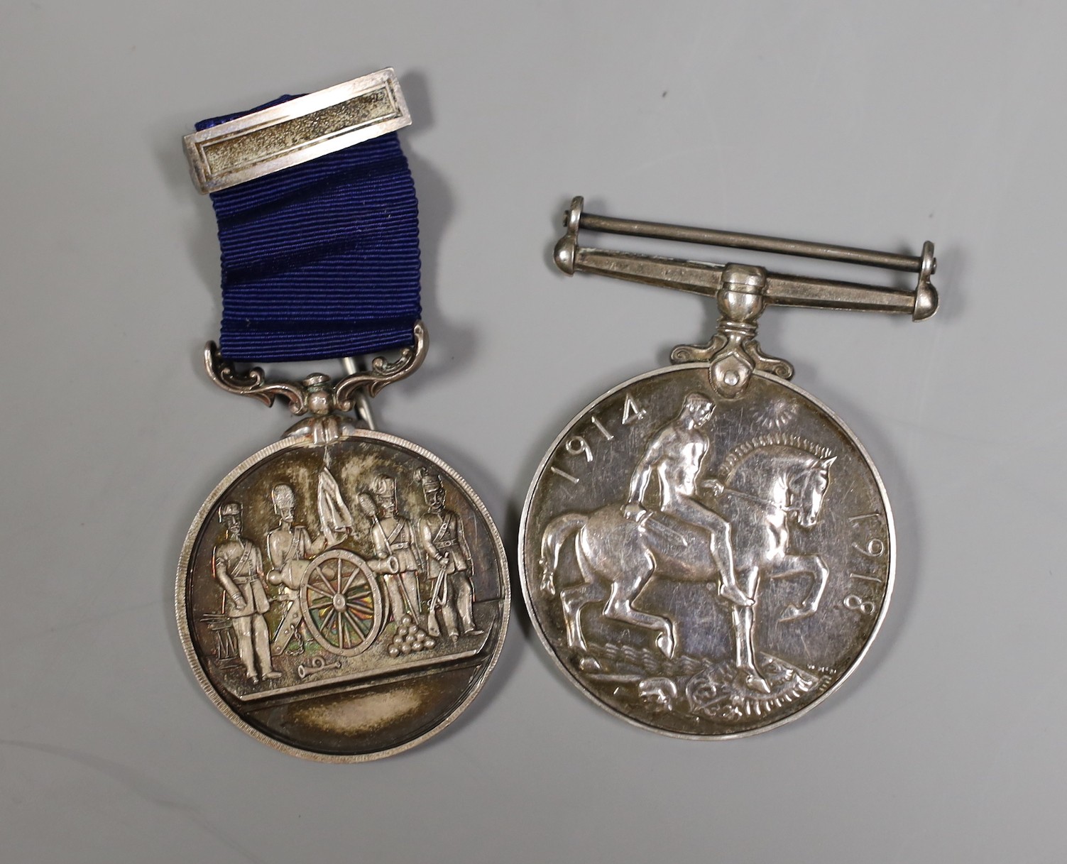 A Victorian Norfolk Artillery Volunteers silver medal and a WWI medal 319213 GNR. W. R. J. BULL. R. A.